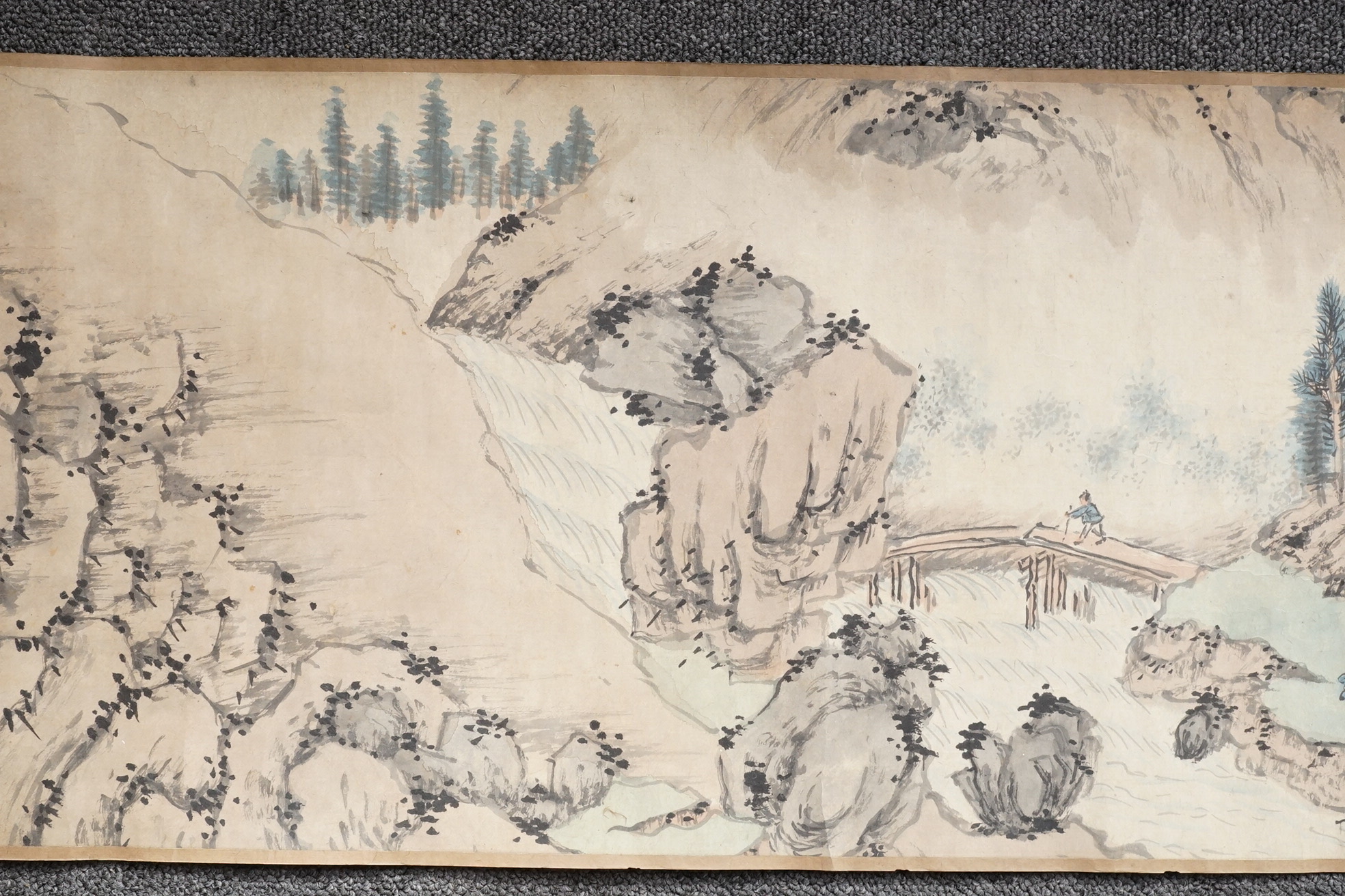 Chinese School , (Qing dynasty), Figures in a mountainous river landscape, Ink and colour on paper handscroll, 268.5cm x 29cm excluding borders